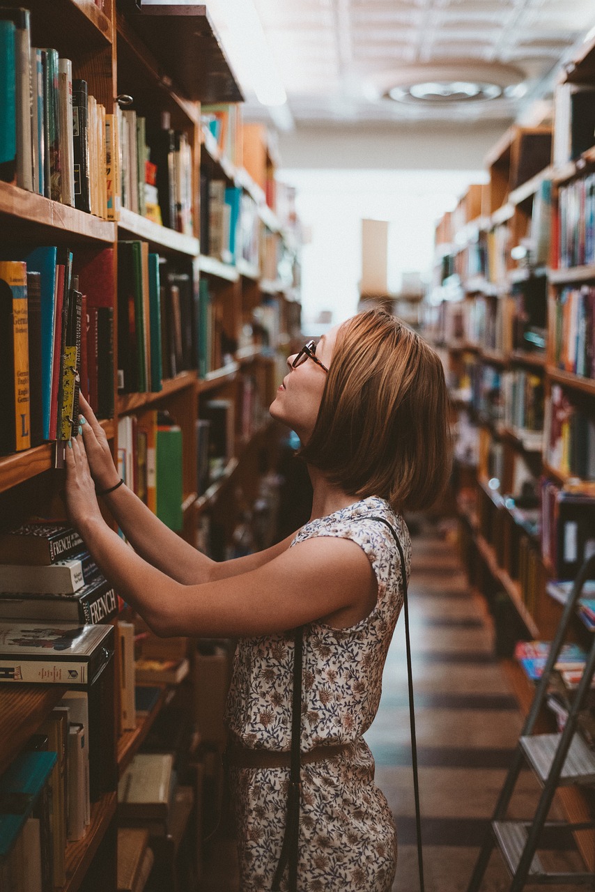 Woman looking at a shelf of books