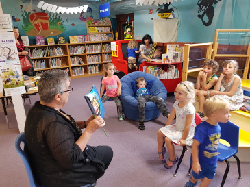 Librarian reading to children