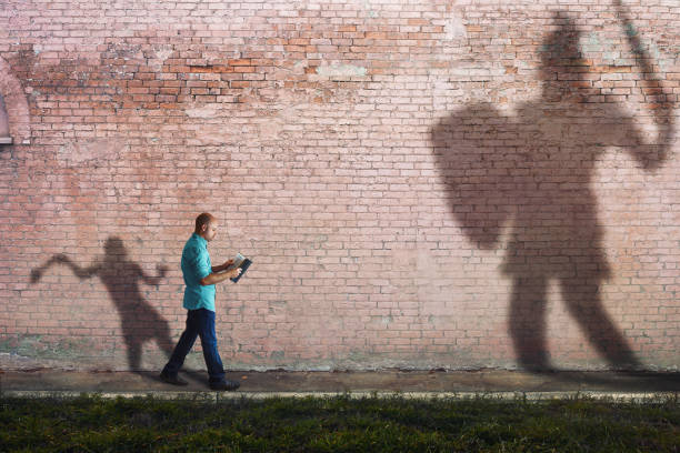 picture of reader with david and goliath background
