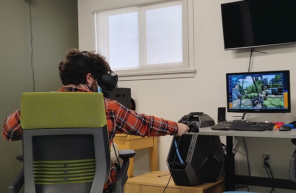 Man using VR headset and controllers