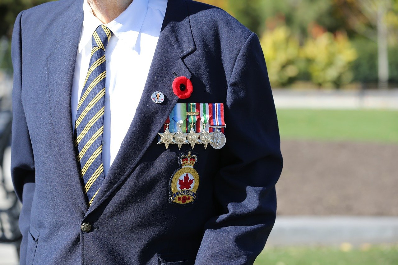 Vetran wearing medals and poppy