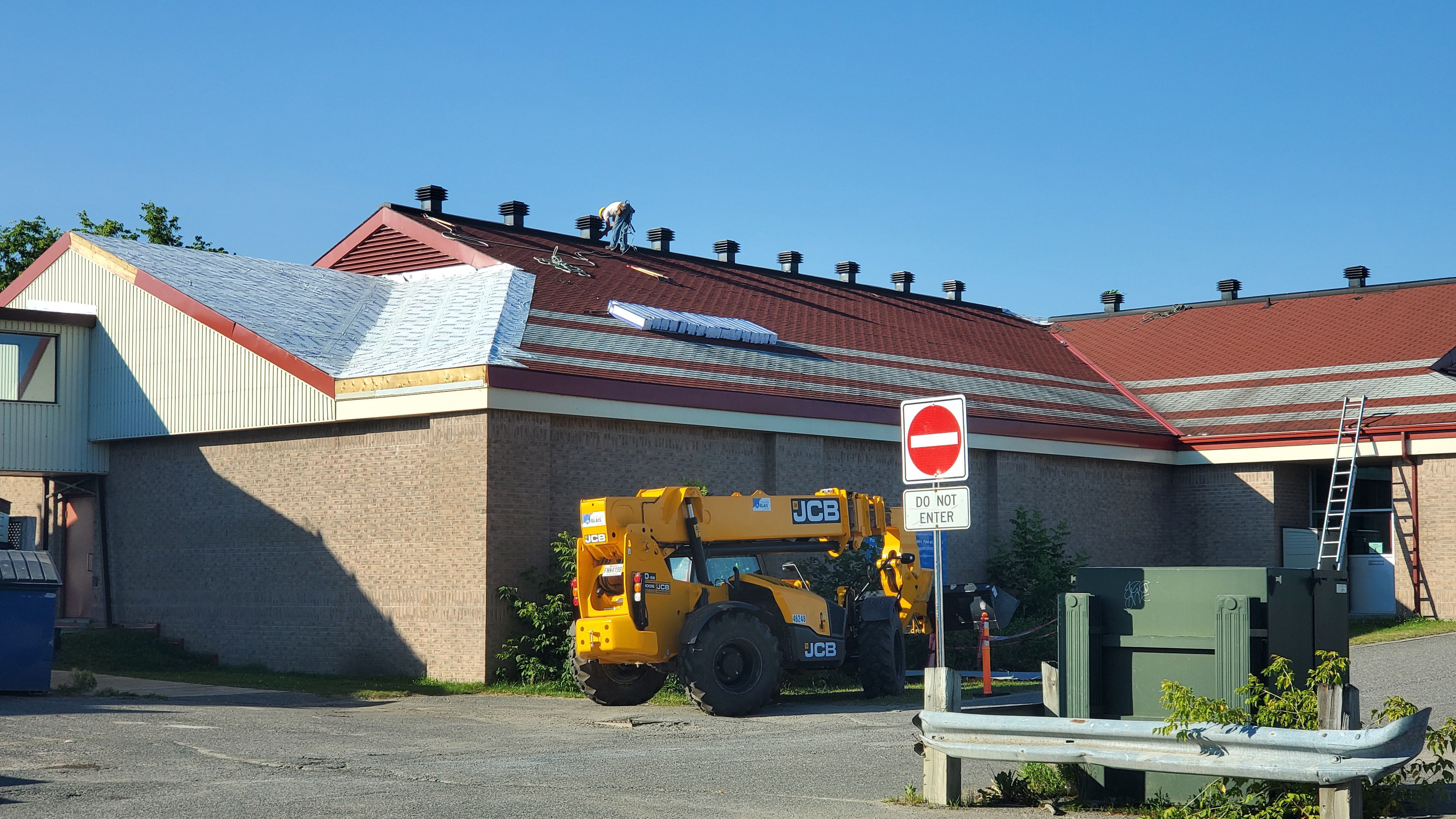 Exterior image of the PFC with part of the shingles removed and roof underlay showing