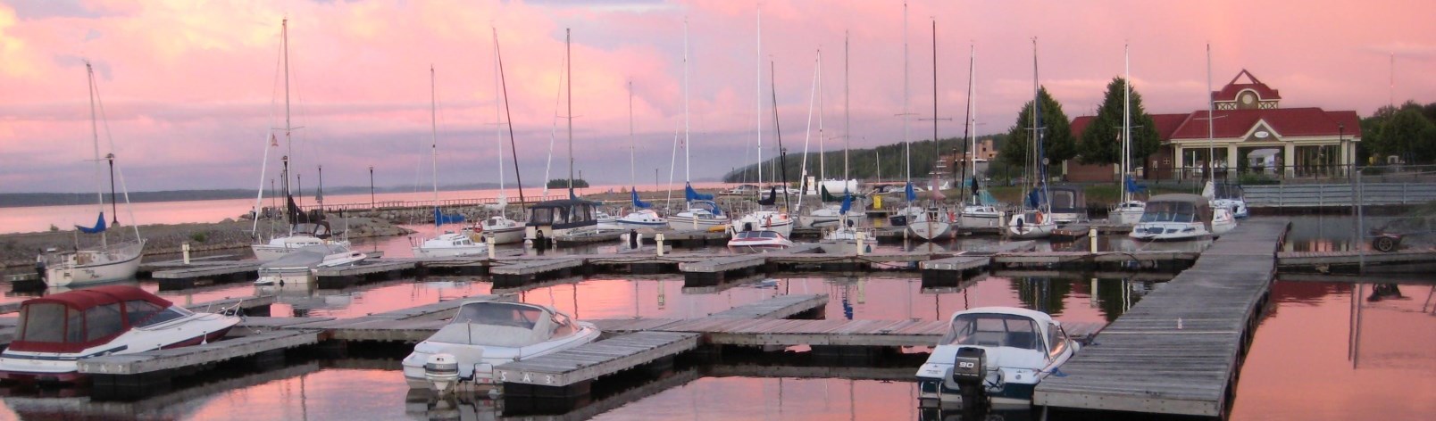 boats in marina at sunset